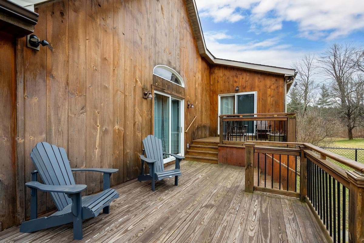 Deck off the kitchen and main living space that leads directly into the fenced in yard.